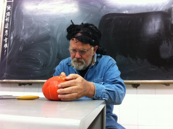 Jim is carving Pumpkin